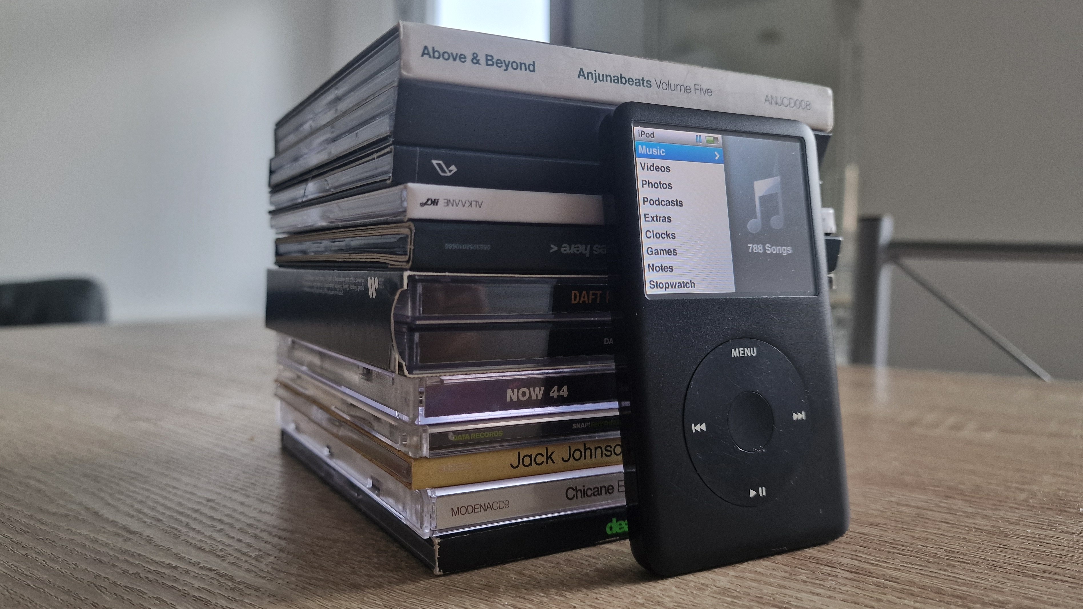 The iPod, next to a large collection of CD albums